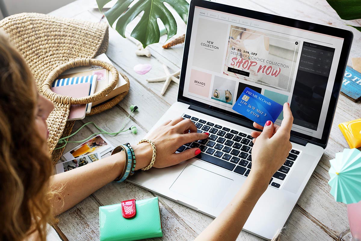 461355724 Person shopping on a laptop